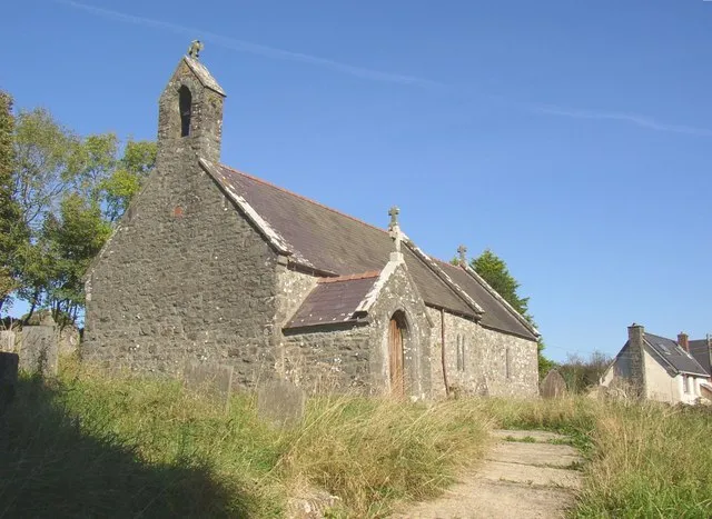 St Non's Church, Llanycefn Built of Preseli stone, but little is medieval, most of the church being rebuilt in 1904. Before that the bellcote was of brick and there were sash windows. The small red rectangle on the west wall is intriguing.