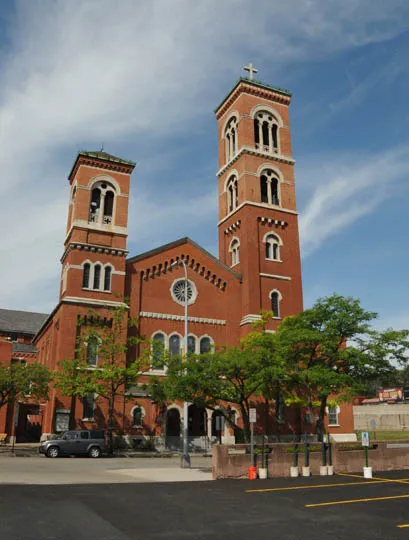 CHURCH WAS BUILT IN 1860 IN EARLY ROMANESQUE REVIVAL AND REBUILT IN 1903 IN LOMBARD ROMANESQUE FORM ATER A FIRE