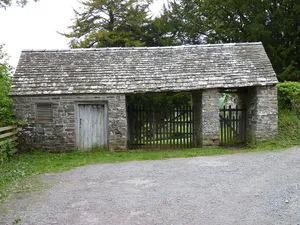 Lych-gate and stable at the entrance to the churchyard of the Church of St Stephen