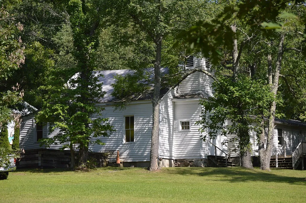 Northwestern side and front of the former John Wesley Methodist Episcopal Church (now the Bath Community Senior Center), located on Warm Springs Drive in West Warm Springs, Virginia, United States. Built in 1873, it is listed on the National Register of Historic Places.