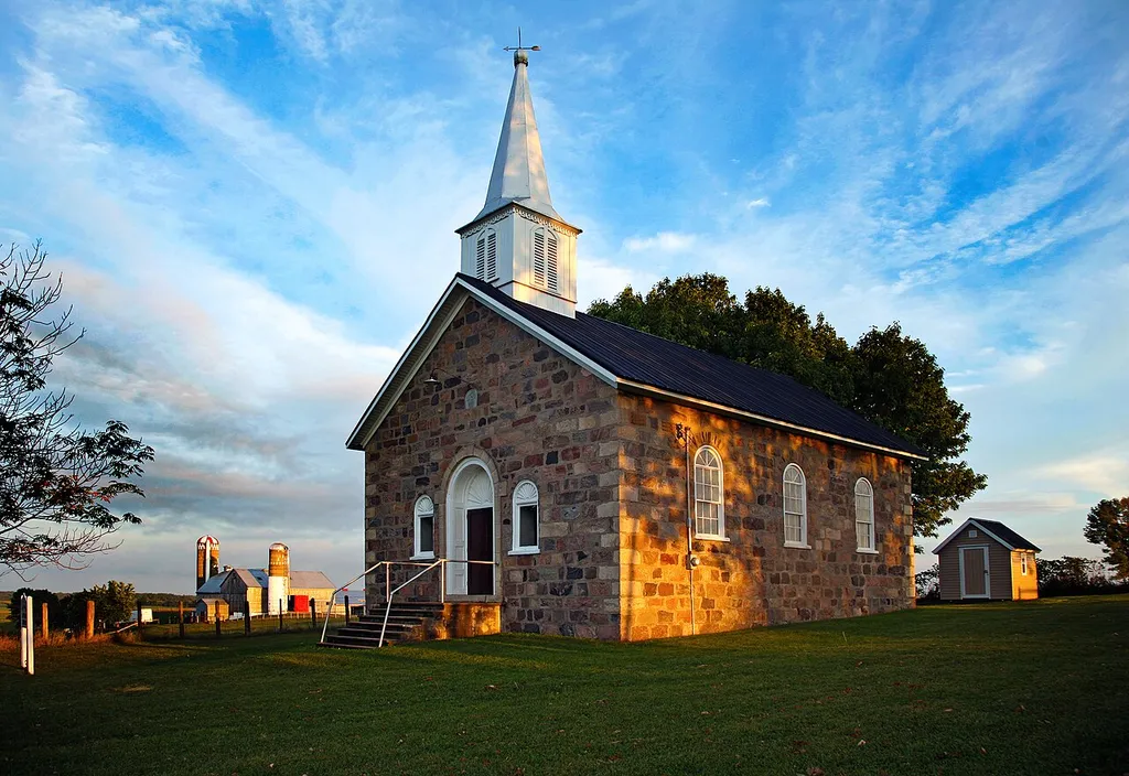 The church is representative of the neo-classical revival style of architecture with a coursed fieldstone exterior and cut limestone quoins. Built in 1872 for early German settlers to the area. It has an engraved dedication stone, "Duetsche ev. Luth./St. Johannes/Kirche/1872"