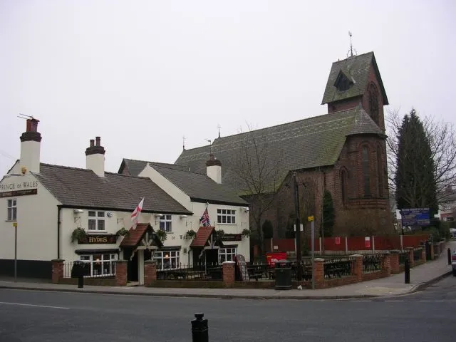 The Prince of Wales pub and St James' parish church at the junction of Church Road and Birch Road, Gatley, Greater Manchester, seen from the northwest