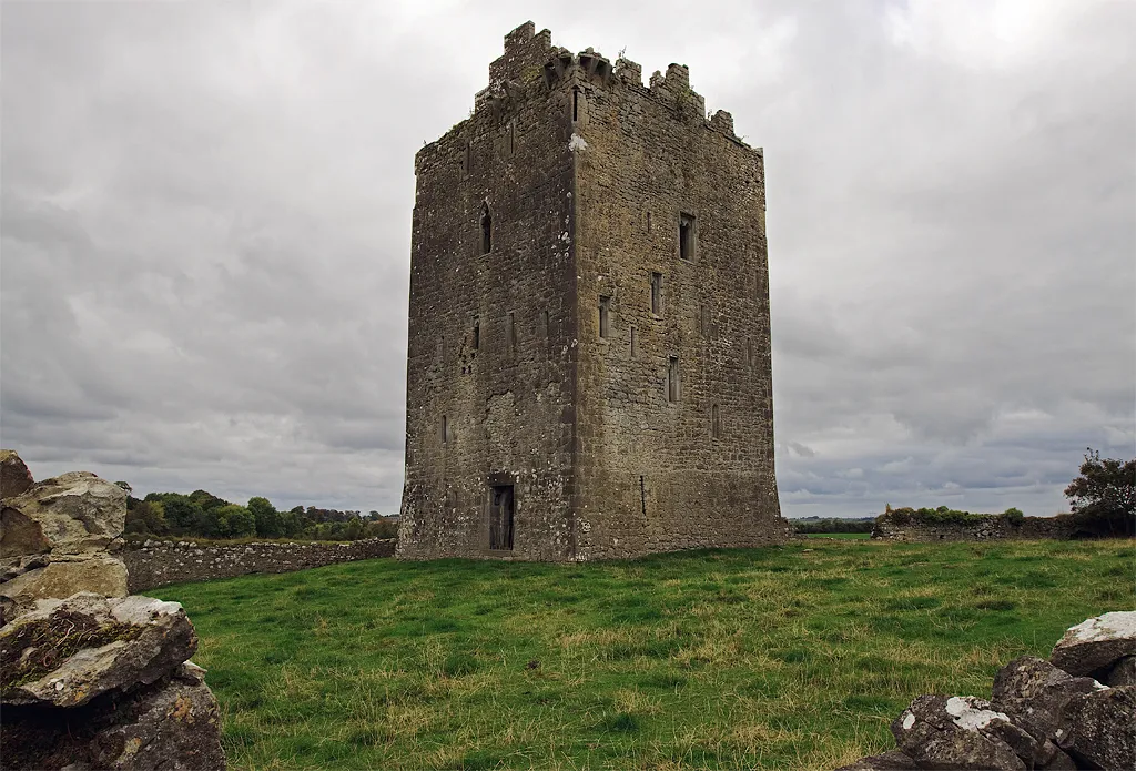 Castles of Munster: Lackeen, Tipperary The location of this castle is just north of the R438 and equi-distant between Portumna and Birr. This tower house with its stepped gables (a later modification) lies within a pentagonal bawn having an arched gateway entrance. The castle belonged to Brian O'Kennedy who died in 1588, and was confiscated by Cromwell in 1653.