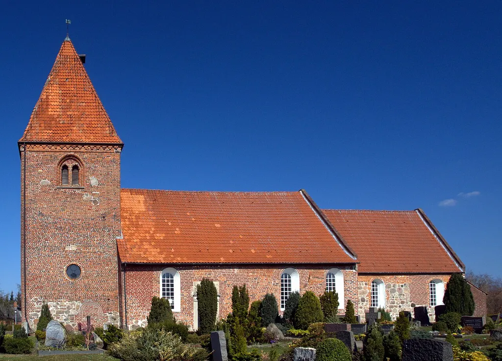 The Lutheran St Ansgar church in Kirchhatten, Oldenburg county, Germany, with the churchyard in the foreground.
