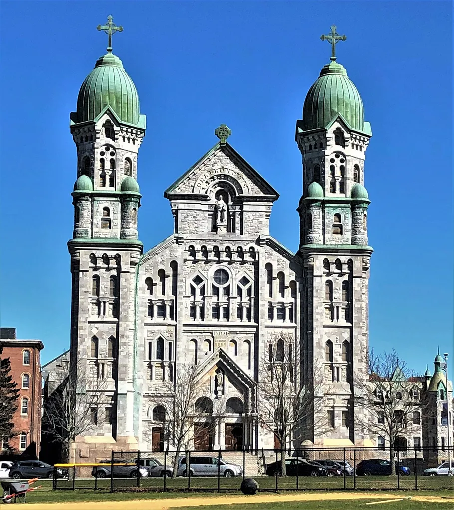 St. Anne's Church and Parish Complex, now St. Anne's Shrine, is located at the intersection of South Main and Middle streets in Fall River, Massachusetts. Until 2018, it was a parish in the Roman Catholic Diocese of Fall River. In addition to the church, the complex also includes the former Dominican Order monastery as well as the former Dominican Academy, constructed in 1894. The great upper church was formally dedicated on July 4,1906 and closed November 25, 2018. The Lower Crypt Church shrine was re-opened July 4, 2019, but the upper part of the church remains closed for restoration and renovation. The church was designed by Canadian architect Napoléon Bourassa in the Romanesque Revival style. Construction began in 1891, and was supervised by Fall River architect Louis G. Destremps. Work began on the upper church on July 17, 1902. The building, which is constructed of blue marble from Proctor, Vermont, measures 277 feet long by 122 wide, with steeples 160 feet high. The exterior was completed in June 1904 and the new church was formally dedicated on July 4, 1906. The church's school was established in the 1880s, with the first classes in the church basement. The new school building opened in 1925, and the school closed in 2007. It is now the Julien F. Paul Campus of the Atlantic Charter Middle School.The complex was added to the National Register of Historic Places in 1983.