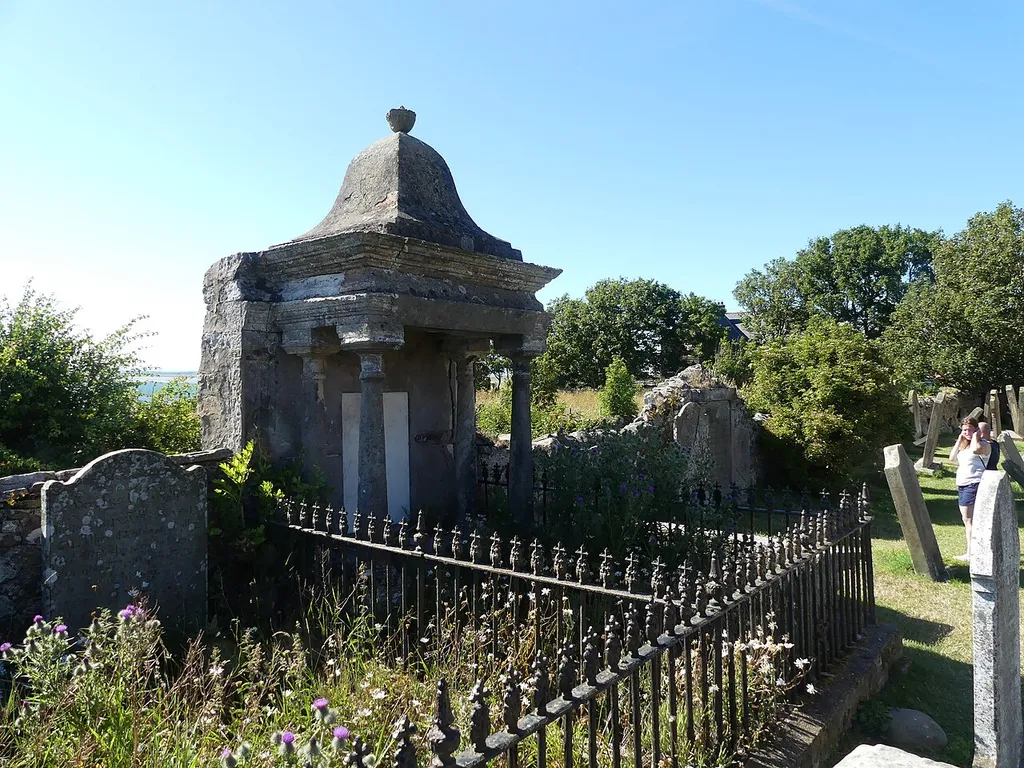 Grade II listed building in Holy Island, Northumberland. Listed as "Sutton (?) Memorial c 25 yards south-west of Church of St Mary". .mw-parser-output .messagebox{margin:4px 0;width:auto;border-collapse:collapse;border:2px solid var(--border-color-progressive,#6485d1);background-color:var(--background-color-neutral-subtle,#fbfcff);color:var(--color-base,#202122);box-sizing:border-box;border-inline-start-width:8px}.mw-parser-output .messagebox.mbox-small{font-size:88%;line-height:1.25em}.mw-parser-output .mbox-warning,.mw-parser-output .mbox-speedy{border:2px solid var(--border-color-error,#b22222);background:var(--background-color-error-subtle,#ffdbdb);border-inline-start-width:8px}.mw-parser-output .mbox-serious,.mw-parser-output .mbox-delete,.mw-parser-output .mbox-stop{border:2px solid var(--border-color-error,#b22222);border-inline-start-width:8px}.mw-parser-output .mbox-issue,.mw-parser-output .mbox-content{border:2px solid #f28500;background:var(--background-color-warning-subtle,#ffe);border-inline-start-width:8px}.mw-parser-output .mbox-query,.mw-parser-output .mbox-style{border:2px solid #f4c430;background:var(--background-color-warning-subtle,#ffe);border-inline-start-width:8px}.mw-parser-output .mbox-shit{border:2px solid #960;border-inline-start-width:8px}.mw-parser-output .mbox-license{border:2px solid #88a;border-inline-start-width:initial}.mw-parser-output .mbox-legal{border:2px solid var(--border-color-notice,#666);background:var(--background-color-base,#fff);border-inline-start-width:8px}.mw-parser-output .mbox-honor{border:2px solid #ca3;background:var(--background-color-warning-subtle,#fcf4db);border-inline-start-width:8px}.mw-parser-output .mbox-growth{border:2px solid #8d4;background:var(--background-color-success-subtle,#d5fdf4);border-inline-start-width:8px}.mw-parser-output .mbox-move{border:2px solid #93c;border-inline-start-width:8px}.mw-parser-output .mbox-protection,.mw-parser-output .mbox-message{border:2px solid var(--border-color-base,#