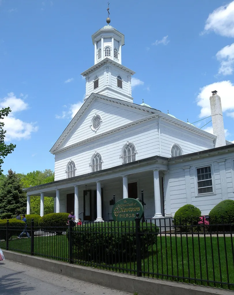 Looking northeast from Broadway at Reformed Dutch Church of Newtown in Elmhurst on a sunny midday.