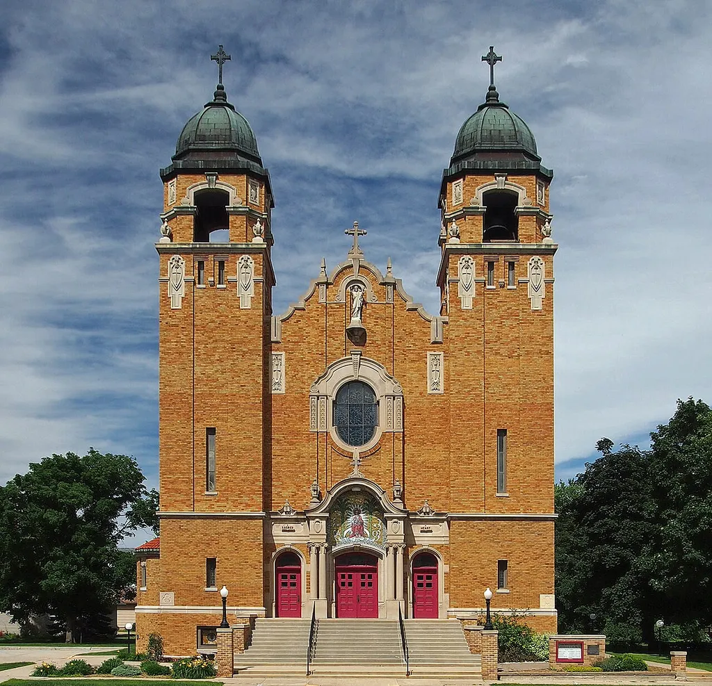 Church of the Sacred Heart, Heron Lake, Minnesota, USA. Viewed from the southwest. This is an image of a place or building that is listed on the National Register of Historic Places in the United States of America. Its reference number is 89000157 (Wikidata).