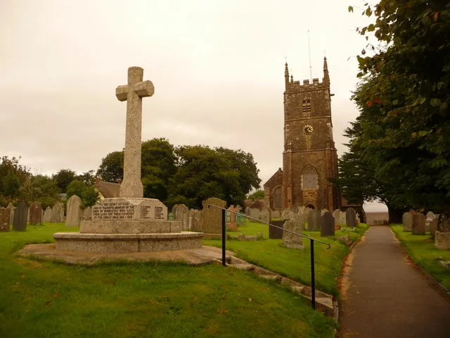 Winkleigh: parish church of All Saints and war memorial Looking east along the churchyard, with the war memorial on the left.