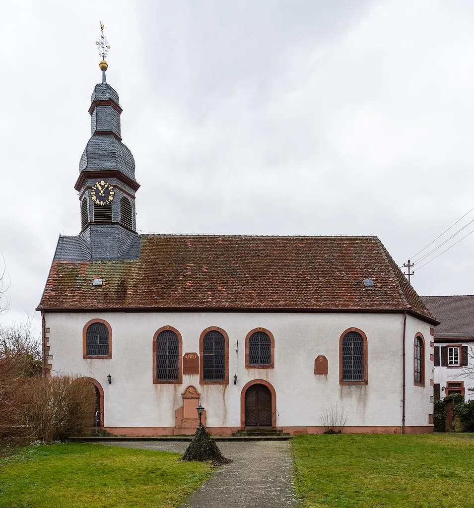 This is a photograph of a cultural monument.It is on the list of cultural monuments of Impflingen. Designation: Protestant parish church Location: Kirchstraße House number: 3 Place: Impflingen, Collective municipality Landau-Land, District Südliche Weinstraße, Rhineland-Palatinate, Federal Republic of Germany Construction time: designated 1726 Description: Baroque hall building